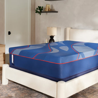 Sealy Posturepedic Elite Brenham II Hybrid Soft Mattress in bedroom — angled lifestyle view