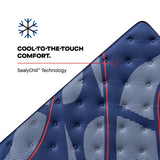 Top-down close-up view of the Sealy Posturepedic® Elite Albany 14-inch Firm Mattress surface, highlighting the quilted texture with SealyChill™ Technology, designed to offer cool-to-the-touch comfort. The mattress features a stylish blue fabric accented with dynamic white patterns and vibrant red lines.