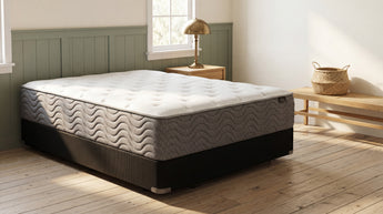 Jamison Easton Plush Mattress bare mattress on foundation in styled bedroom, Mattress Overstock Kentucky