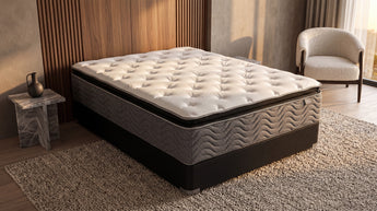 Jamison Easton Pillowtop Mattress bare mattress on foundation in styled bedroom, Mattress Overstock Kentucky