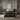Front view of a luxurious Beautyrest Black mattress set in an elegant, modern bedroom featuring neutral tones, floating wooden shelves, minimalistic décor, and soft lighting, highlighting the sophisticated black quilted design of the mattress