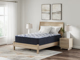 Sierra Sleep Firm Luxe 2.0 Mattress, angled bedroom view on wood platform bed