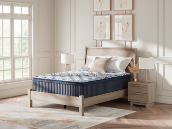 Sierra Sleep Plush Luxe 2.0 Mattress, angled lifestyle view on bed frame
