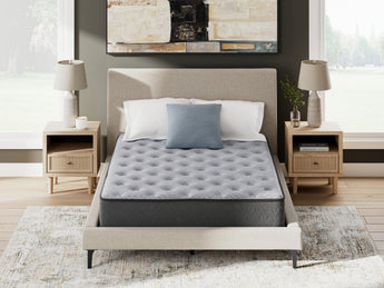 Sierra Sleep Comfort Plus Mattress, front on view on a bed frame in a neutral bedroom