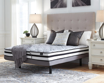 Sierra Sleep 8 Inch Chime Innerspring Mattress on an adjustable base in a bright bedroom