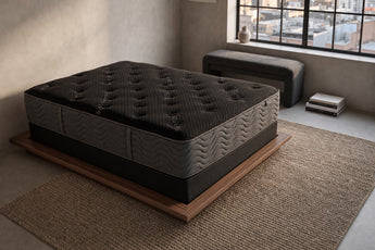 Jamison Clarion Firm mattress in a styled bedroom, top view of the quilted sleep surface