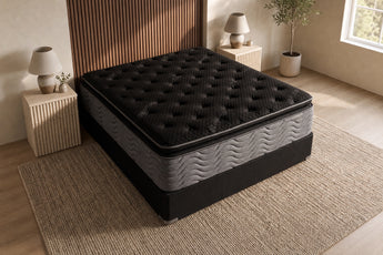 Jamison Clarion Ultra Plush Pillowtop mattress in a styled bedroom, top view of the quilted sleep surface