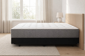 Jamison Easton Firm mattress in a styled bedroom, side profile showing the mattress height