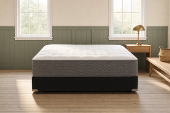 Jamison Easton Plush mattress in a styled bedroom, foot-of-bed view