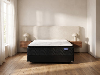 Jamison Sleep Response 5 Star mattress, foot-of-bed view in a styled bedroom