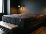 Jamison Sleep Response Apex Pro Cushion Firm mattress, foot-of-bed view in a styled bedroom