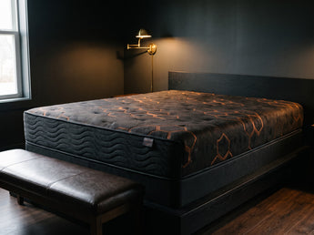 Jamison Sleep Response Apex Pro Cushion Firm mattress, three-quarter view in a styled bedroom