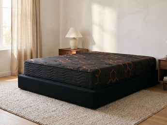 Jamison Sleep Response Elevate Plush mattress, three-quarter view in a styled bedroom