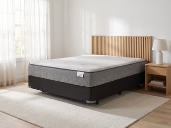Jamison Sleep Response Ignite Plush mattress, three-quarter view in a styled bedroom