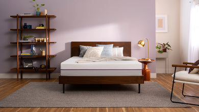 Purple matress on a bed frame in a Mattress Overstock Kentucky showroom