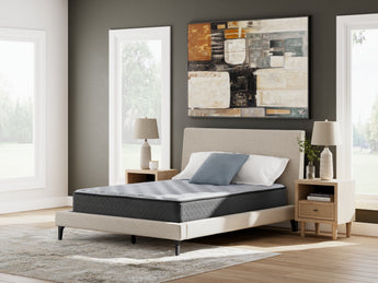 Sierra Sleep Comfort Plus Mattress, angled view on a bed frame in a neutral bedroom
