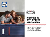 Sealy advertisement showing a couple lying with their golden cocker spaniel on a blue Posturepedic Elite mattress. The image highlights the brand's orthopedic focus with text reading "INSPIRED BY ORTHOPEDIC SPECIALISTS." Additional copy states "Improved back posture + orthopedic support = Sealy Posturepedic®." The Sealy logo appears in the top left, and a simple line drawing of a bed with nightstands is shown on the right. The navy blue mattress with red accent lines and Posturepedic Elite branding is promi