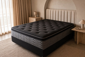 Jamison Clarion Eurotop mattress in a styled bedroom, top view of the quilted sleep surface