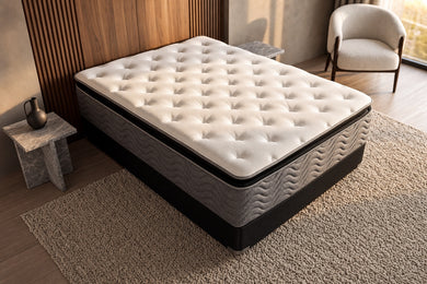 Jamison Easton Pillowtop mattress in a styled bedroom, top view of the quilted sleep surface
