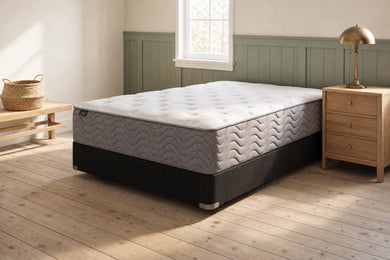 Jamison Easton Plush mattress in a styled bedroom, styled bedroom angle