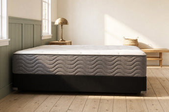 Jamison Easton Plush mattress in a styled bedroom, side profile showing the mattress height
