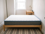 Jamison Sleep Response Aria mattress, foot-of-bed view in a styled bedroom