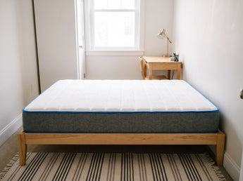 Jamison Sleep Response Aria mattress, foot-of-bed view in a styled bedroom