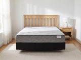 Jamison Sleep Response Ignite Plush mattress, foot-of-bed view in a styled bedroom