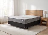 Jamison Sleep Response Ignite Plush mattress, three-quarter view in a styled bedroom