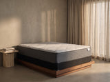 Jamison Sleep Response Ion Plush mattress, three-quarter view in a styled bedroom