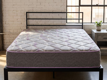 Jamison Sleep Response Lyric mattress, foot-of-bed view in a styled bedroom