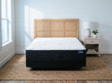 Jamison Sleep Response Premier Firm mattress, foot-of-bed view in a styled bedroom